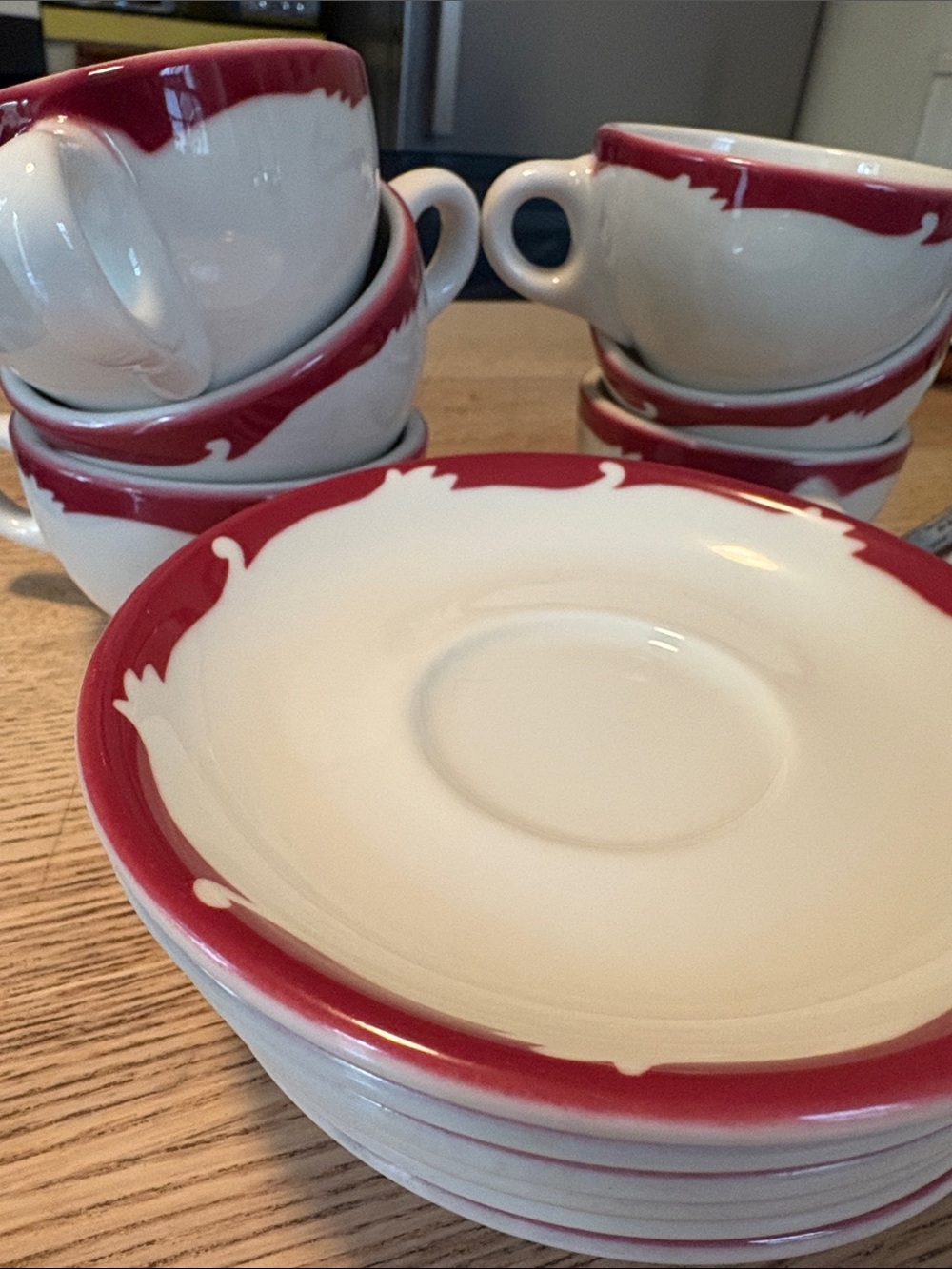 White Ceramic Tea Cup and Saucer Set with Red Border